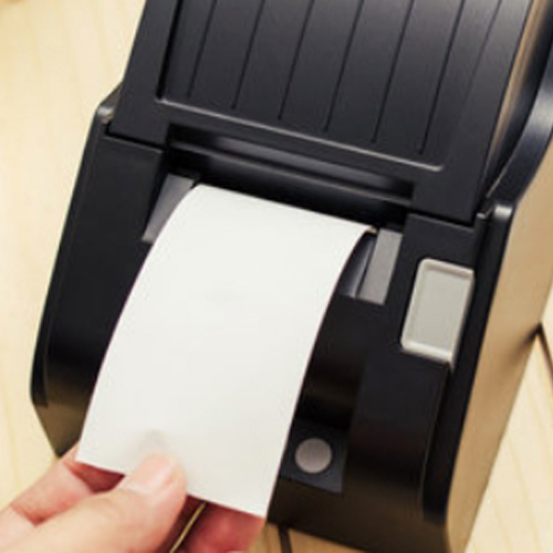 Person taking till roll out of printer
